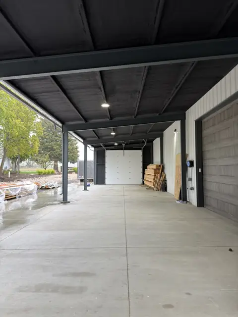 Steel building with covered bay