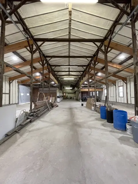 Pole barn interior with foamed walls and roof
